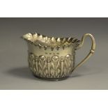 A Victorian silver cream jug, Birmingham 1891,