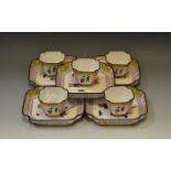 A set of five Chinese enamelled tea bowls and tray saucers,