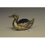 An Edwardian silver pin cushion, as a Duck by C&N, Birmingham 1946, 17.