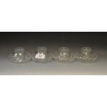 Four glass inkwells