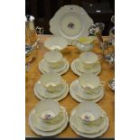 A Paragon 'Fleur de Lis' pattern tea service for six, including tea cups and saucers, side plates,