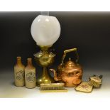 A 20th century brass oil lamp; a brass kettle;