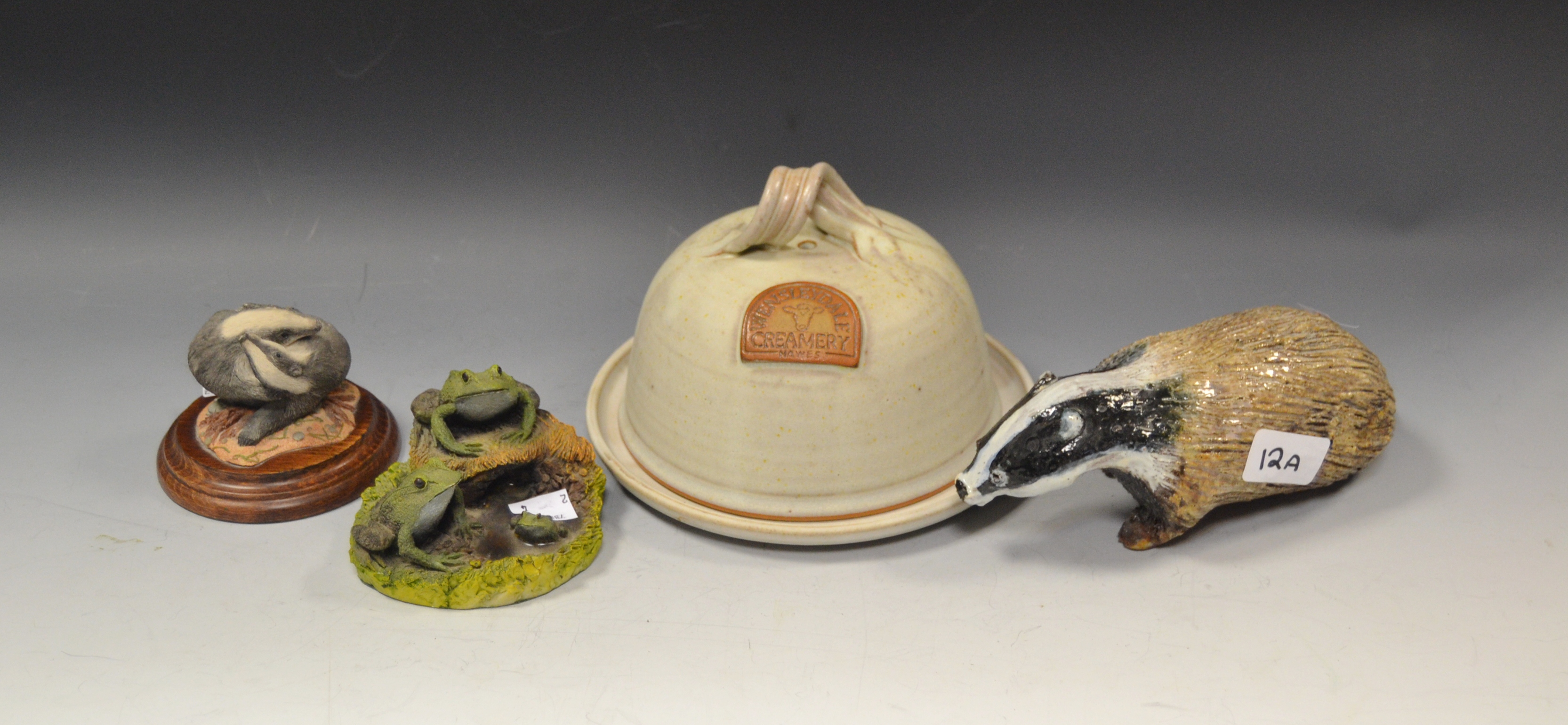 A stoneware Wensleydale Creamery cheese dish and cover; a stoneware model of a Badger;