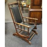 An early 20th century American style rocking chair, c.
