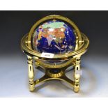 A desk top gemstone globe