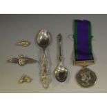 A silver RAF brooch; two silver charms, Vesta moped; another,