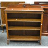 A mid 20th century oak open shelf bookcase, Greek key carved frieze, c.