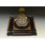 A Victorian walnut revolving inkstand, c.