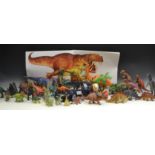 Toys - a model Triceratops, others; a Velociraptor; other dinosaurs; etc,