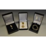 A 9 ct gold cameo on chain; an Italian 9 ct white gold necklace; another 9 ct white gold necklace,