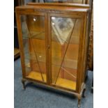 An Edwardian oak Art Deco two door display cabinet