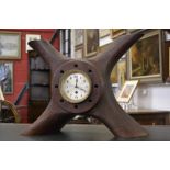 An eight day clock mounted in a World War I four bladed wooden propeller boss stamped T6296 1917