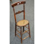 A Victorian child's correctional chair, bobbin turned uprights, carved horizontal splat.