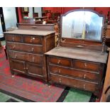 A 1940's oak dressing chest, oval mirror, barley twist uprights,