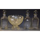 Glass- a trio of decanters and stoppers,