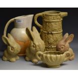 A graduating set of three Denby type stoneware rabbits; a Beswick drip glaze ale jug, printed, c.