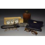 A cased pince nez; cased tortoiseshell spectacles; pewter and pigskin flask; a snuff box;