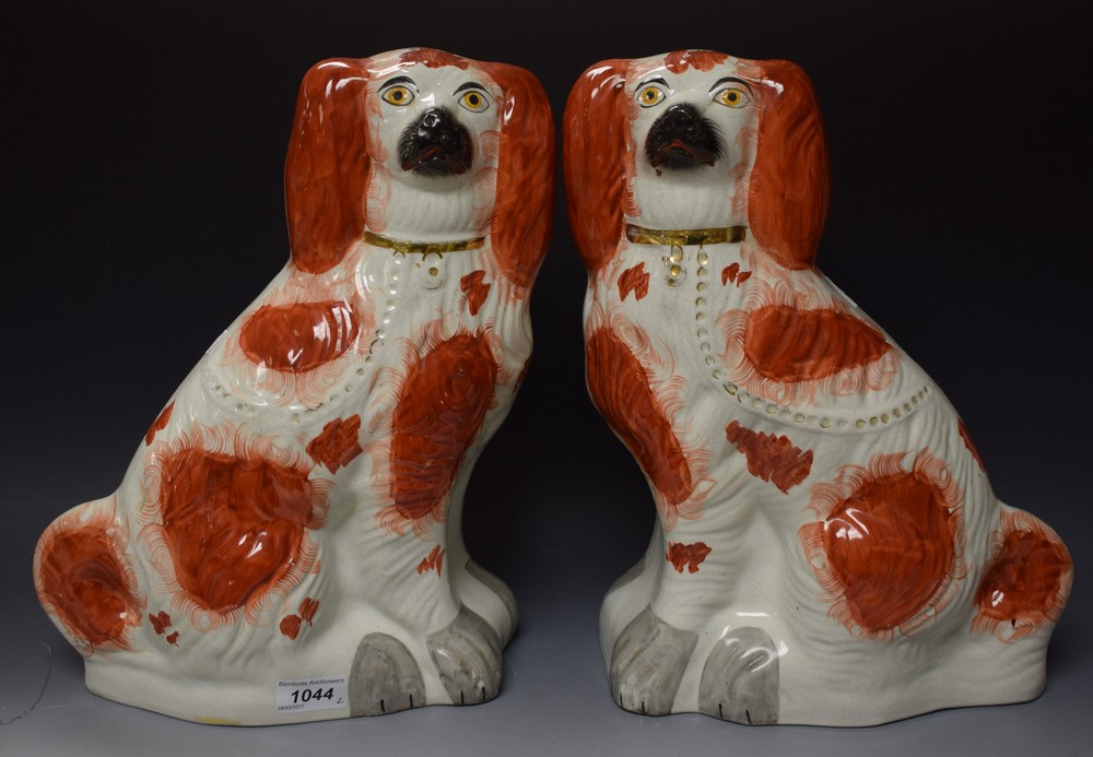 A pair of large Victorian Staffordshire chimney spaniels