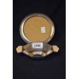 A silver two handled octagonal dish, Sheffield 1934; a silver circular photograph frame,