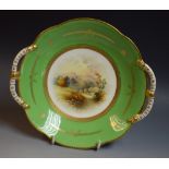 A Coalport plate, Percy Simpson 1901-1920, hand painted landscape,