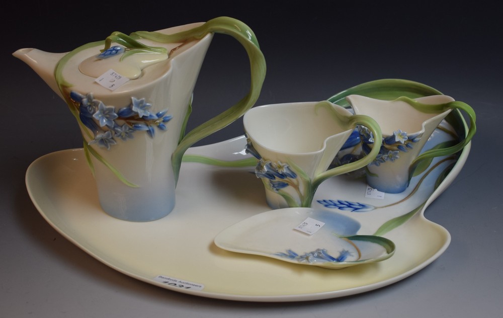 Franz Porcelain - a tea for one set, comprising a teapot, cup and saucer, milk jug and tray,