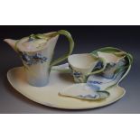 Franz Porcelain - a tea for one set, comprising a teapot, cup and saucer, milk jug and tray,