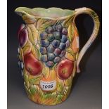 A Falcon Ware jug relief decorated with colourful fruit