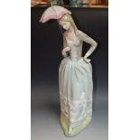 Lladro figure of a young woman carrying a filigree parasol,