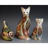 Royal Crown Derby paperweights - a Siamese cat; a Siamese kitten; a blue tit; all gold stoppers,