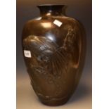 A large Japanese Meiji period bronze eagle and serpent vase