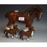 A pair of Beswick models, Shetland Foals, No 1034, both gloss; a larger Shire horse,
