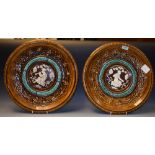 A pair of Clément Massier wall plaque chargers,