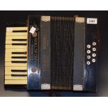 An early 20th Century piano action Italian accordeon with instruction manual