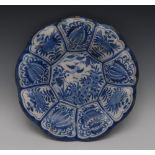 An early 18th century Delft fluted shaped circular charger,