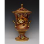 A Caverswall two handled campana shaped urn and cover, decorated with by Micheal Bates,