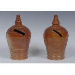 A Brampton brown salt glazed stoneware beehive money box, applied with Cupids at work,