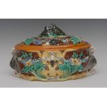 A Wedgwood majolica oval game pie tureen and cover, moulded in relief with floral swags,