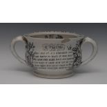 A Staffordshire two-handled chamber pot, the rim inscribed in black For A Kiss I'll Hand You This,