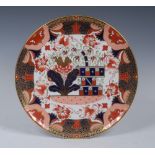 A Spode circular charger, decorated with stylised leaves and foliage, in the Imari palette, 30.