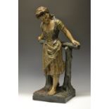 A large Bretby Clanta Ware terracotta figure, of a rustic girl, she stands leaning a fence,