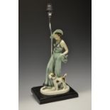 An Art Deco chrome table lamp, the plinth base mounted with an earthenware figure,