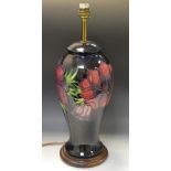 A large contemporary Moorcroft Clematis pattern baluster lamp base,