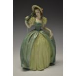 An Austrian earthenware figure of a crinoline lady in green dress and bonnet, 25cm,