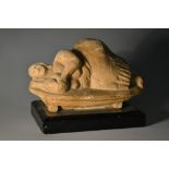 A Studio Pottery naieve clay model of a reclining female, in sandy tones, 12cm wide,