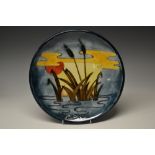 A contemporary Moorcroft Reeds at Sunset pattern circular plate,