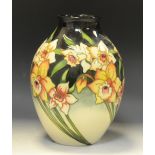 A contemporary Moorcroft ovoid vase, tube lined with daffodils, on a green/cream ground, 22cm high,