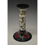 A contemporary Moorcroft Macintosh Rose pattern candlestick,