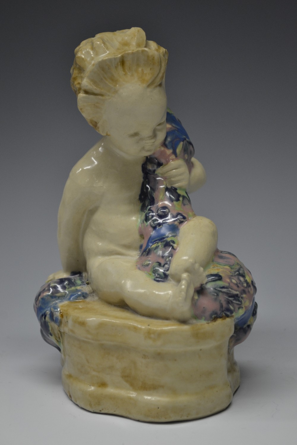 A Hammersmith Pottery figure, Buster Boy, modelled by Phoebe Stabler,