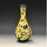 A contemporary Moorcroft Sweet Thief pattern slender ovoid bottle vase,