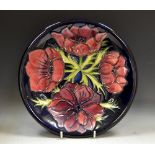 A contemporary Moorcroft Anemone pattern circular plate,